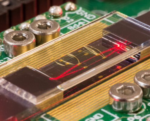 packaging of photonic module showing optics and electronics assembly