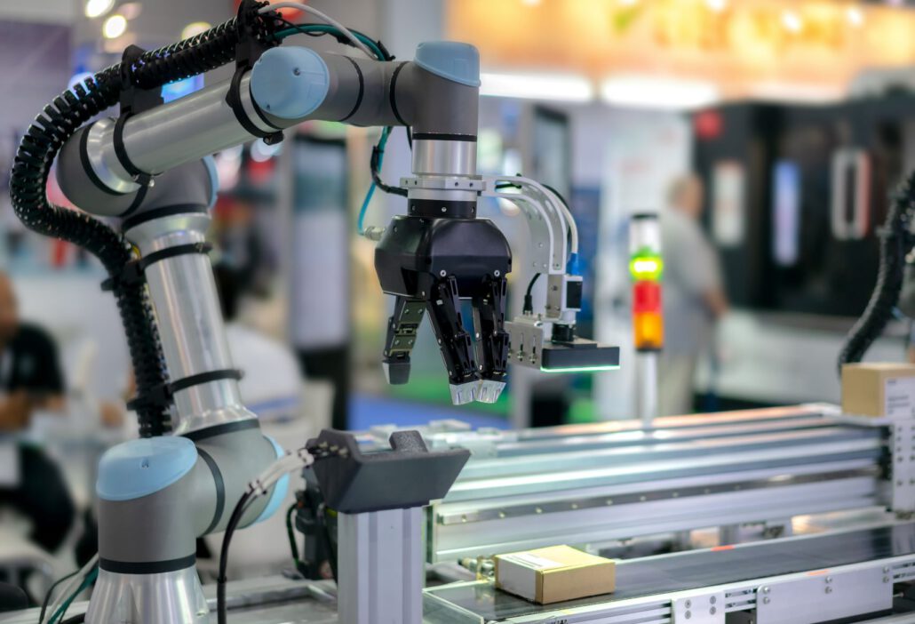 A robotic arm on a production line usedf to illustrate MEMS sensing applications