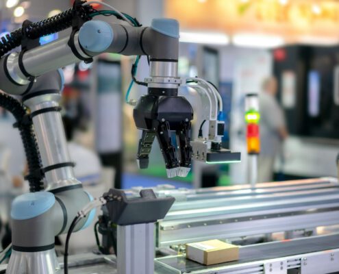 A robotic arm on a production line usedf to illustrate MEMS sensing applications