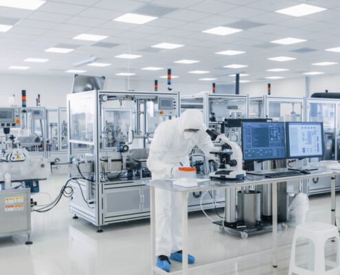 Scientists working in pharmacology lab where lifescience MEMS are used