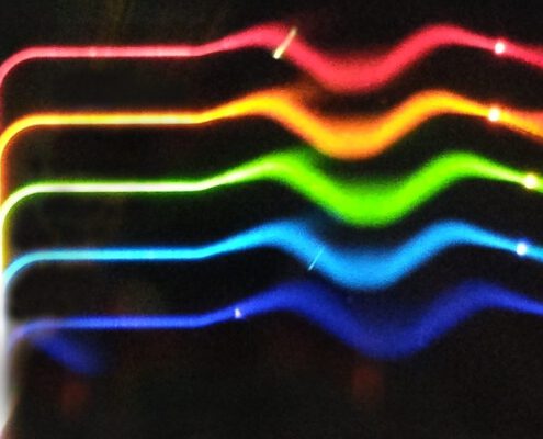 A visible light MPW chip with red green and blue waveguides.