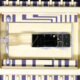 A photo of the fully assembled and wire-bonded laser module in a 14-pin butterfly package.