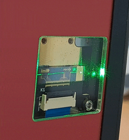 Structured light module in operation, emitting light out-of-plane from the chip.