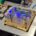 The full assembly of the AR/VR prototype is demonstrated. Using a custom PCB, the chip is assembled with all components on a submount. The diodes and heaters are then wirebonded on to the PCB to drive the functional chip electronically. In this picture, the modulation of the blue diode is shown.
