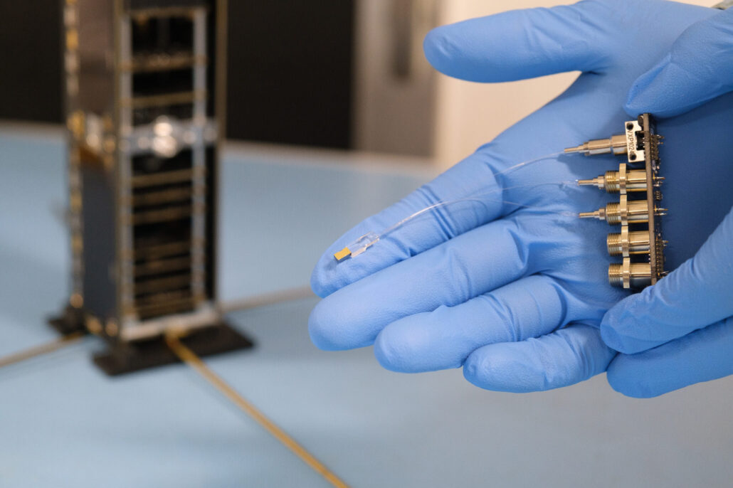 The PRISM payload with the asymmetric Mach-Zehnder Interferometer photonic chip, laser and photodiode, together with the PocketQube satellite bus it will fly on The PRISM payload with the asymmetric Mach-Zehnder Interferometer photonic chip, laser and photodiode, together with the Delfi-Connect satellite bus it will fly on.